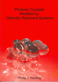 Cover of Photonic crystals modified by optically resonant systems