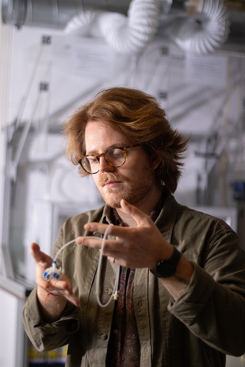 Alberto Comoretto and his insect-like soft robot in the lab 