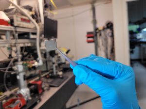 Different colors of light coming from a grating of a sample by changing the angle of light hitting